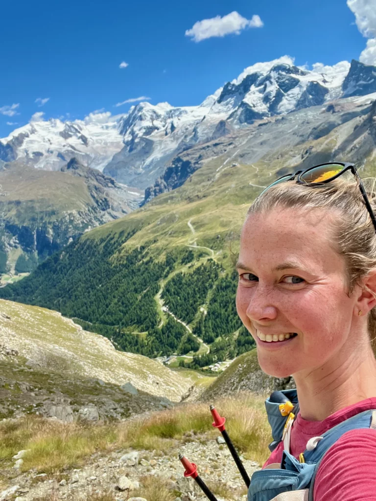 Hiker in Zermatt with Swiss Alps in the background