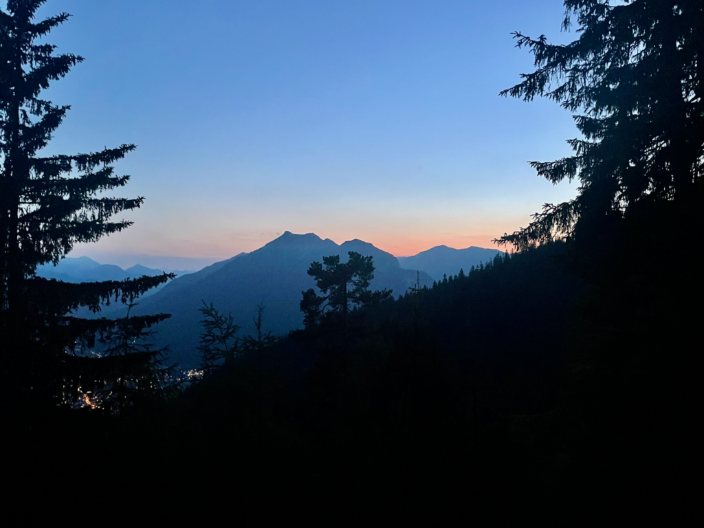 women in the evening looking at mountains